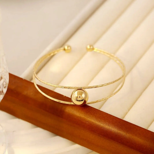 Bracelet jonc doré double ligne avec boule Eclat Paris