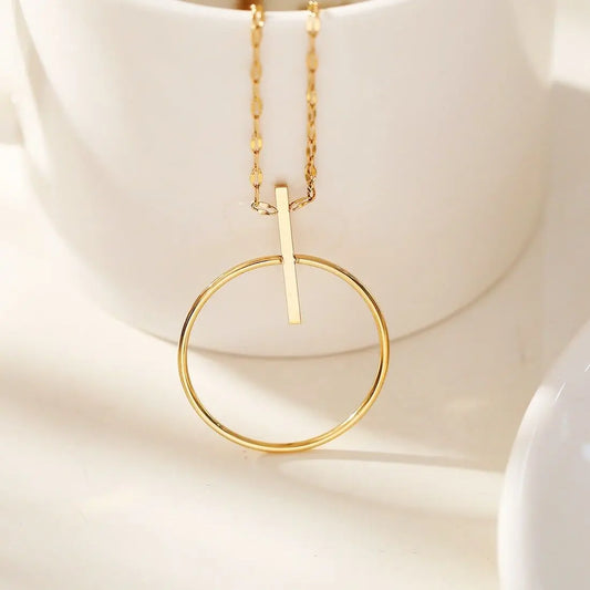 Collier doré cercle et barre Eclat Paris